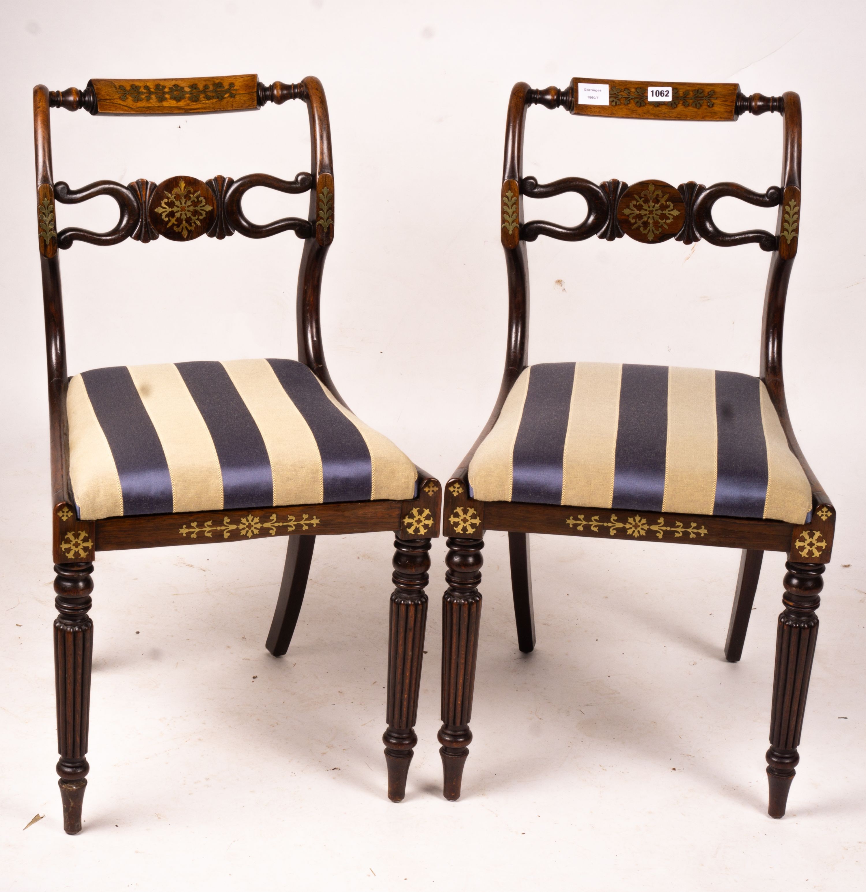A set of six Regency brass inset simulated rosewood dining chairs